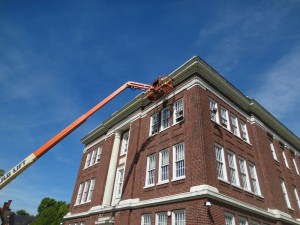 Commercial masonry contactor repairing brick building